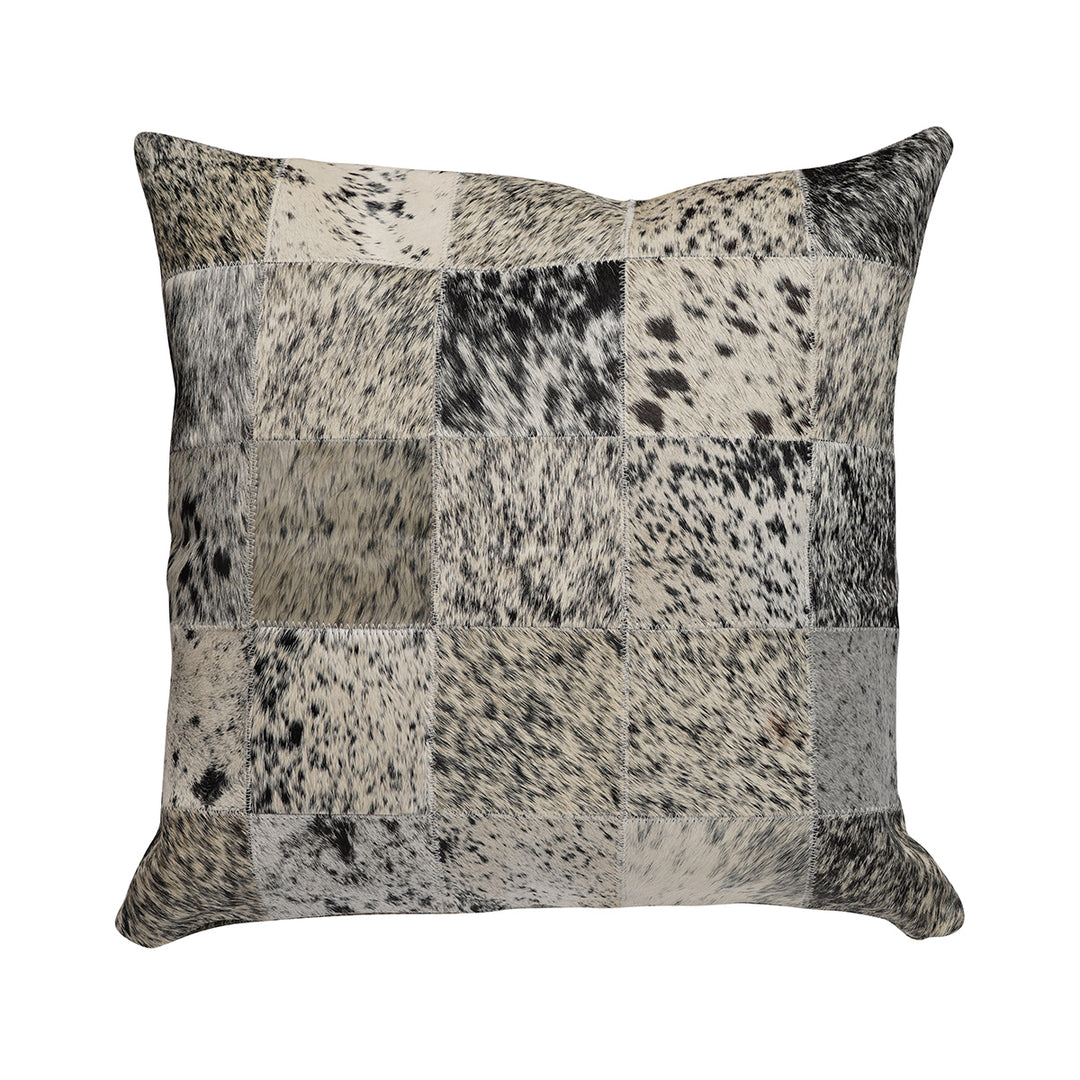 Square pillow featuring a patchwork design in black, white, and gray hair on hide with a salt-and-pepper speckled pattern across the squares.