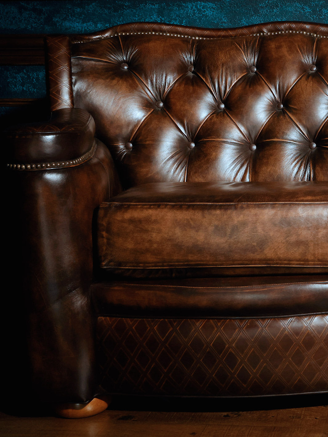 Brown tufted leather sofa