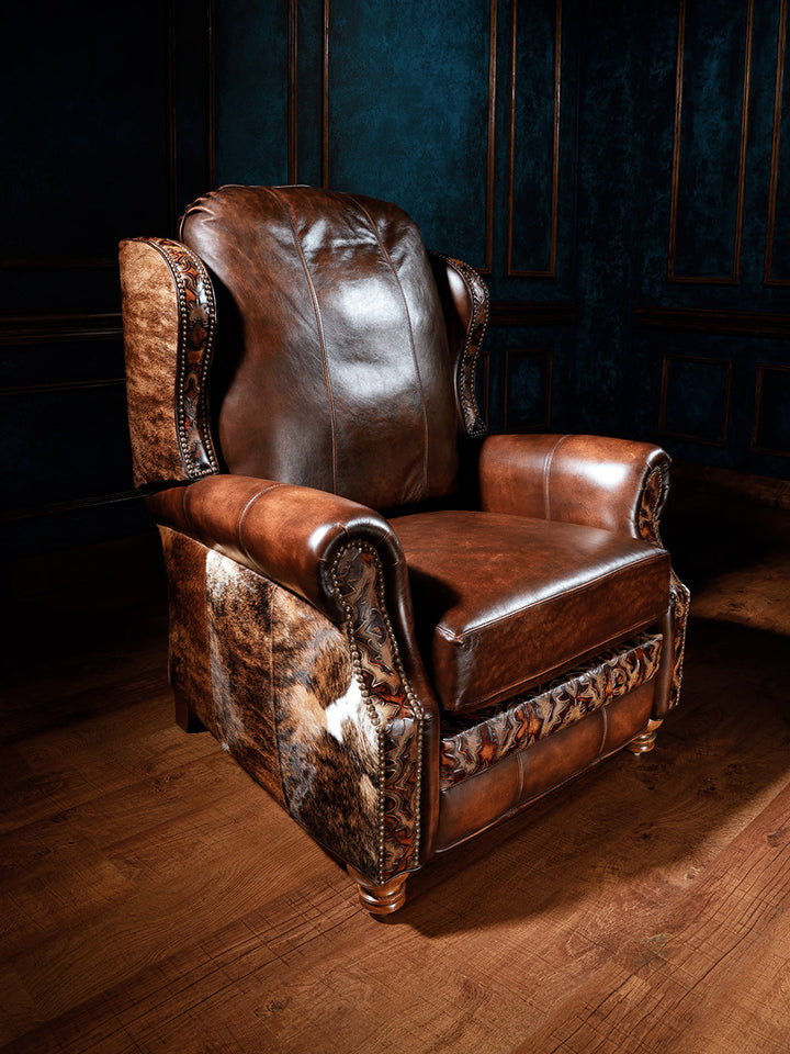 Blackstone Western Leather Recliner in burnished brown full grain leather with Loredo embossed inlays and cowhide accents in a rustic living room.
