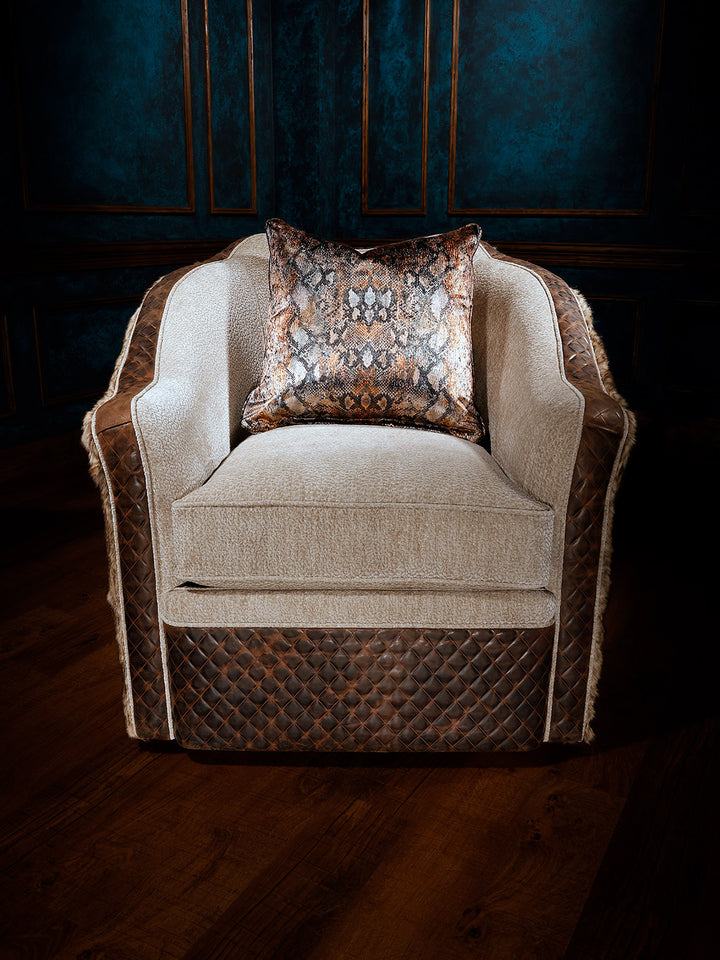 front view of fabric and leather swivel chair with decorative pillow
