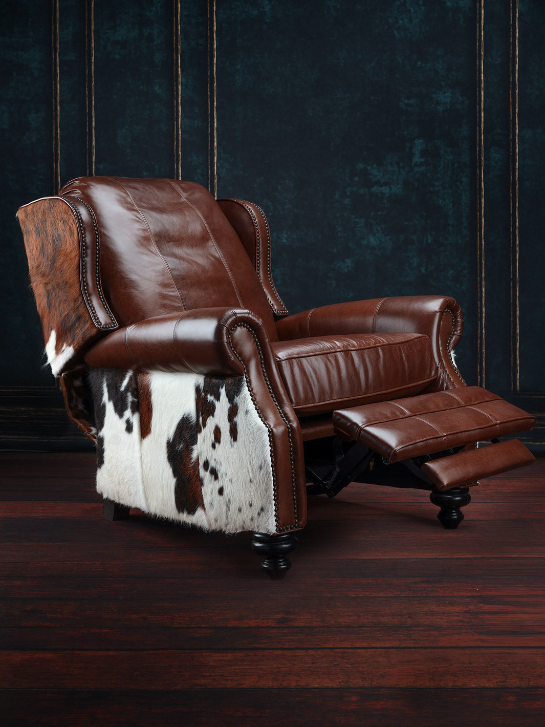 Bushwacker Leather and Cowhide Recliner in full-grain brown leather with cowhide accents in a Western living space.