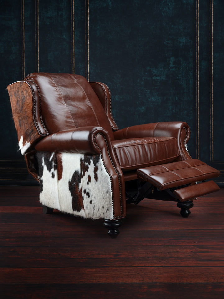 Bushwacker Leather and Cowhide Recliner in full-grain brown leather with cowhide accents in a Western living space.