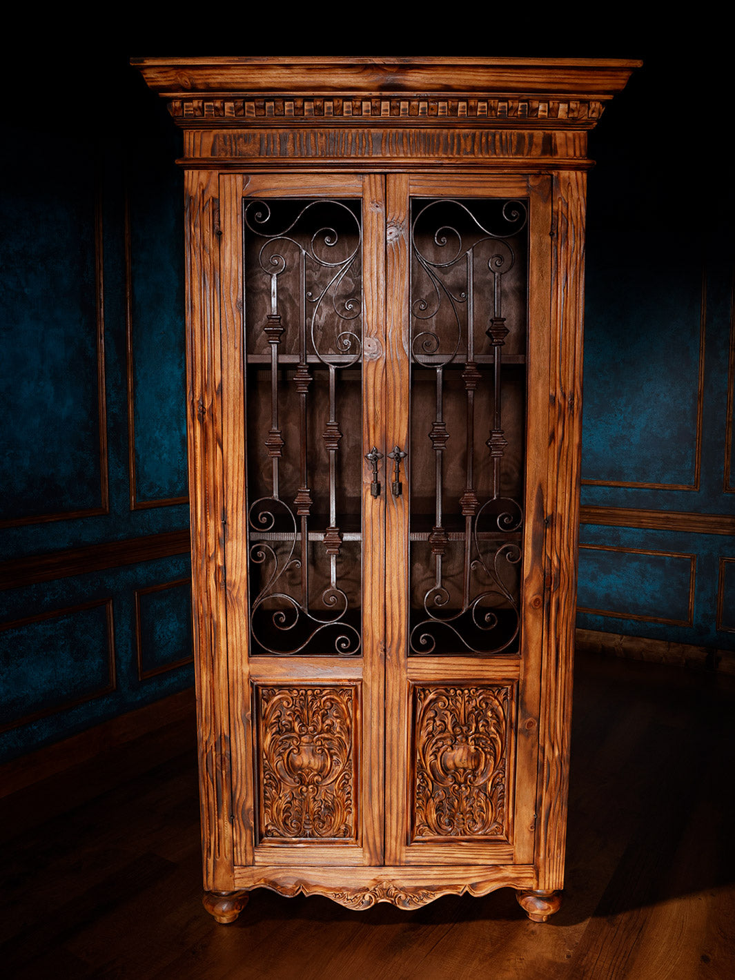 brown wooden armoire with iron