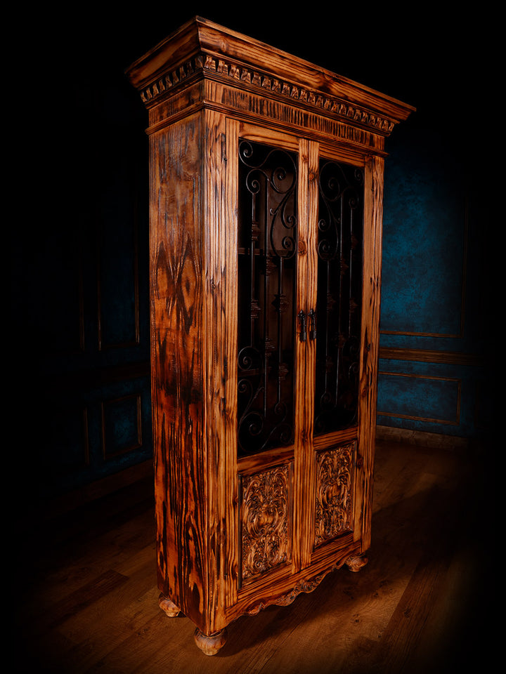 side view of brown wooden armoire with iron