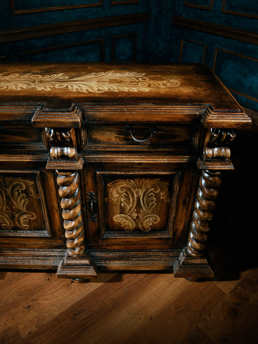 close up view of carved wooden buffet with 3 doors