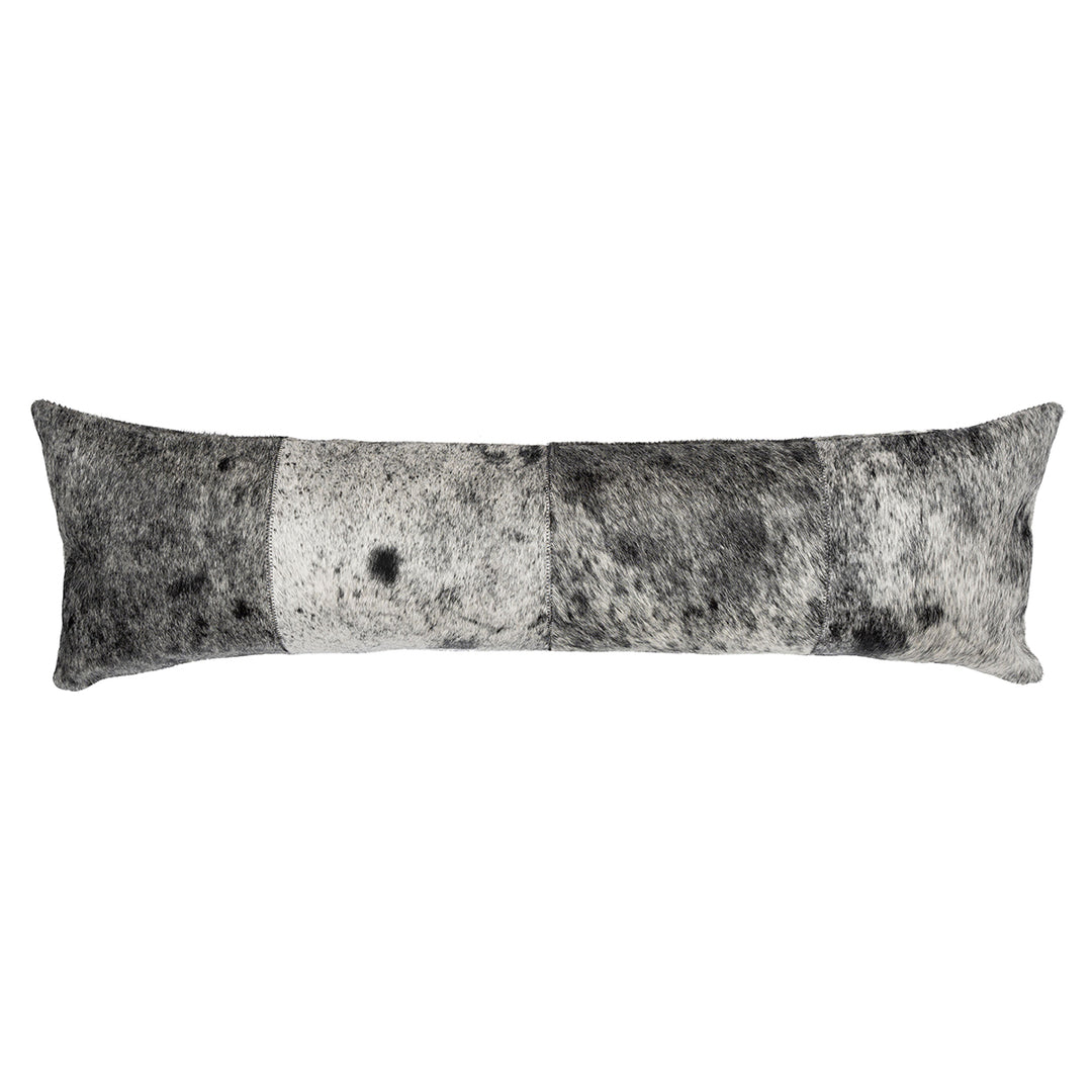 Long lumbar pillow in a patchwork design featuring black, white, and gray hair on hide with a salt-and-pepper speckled pattern.