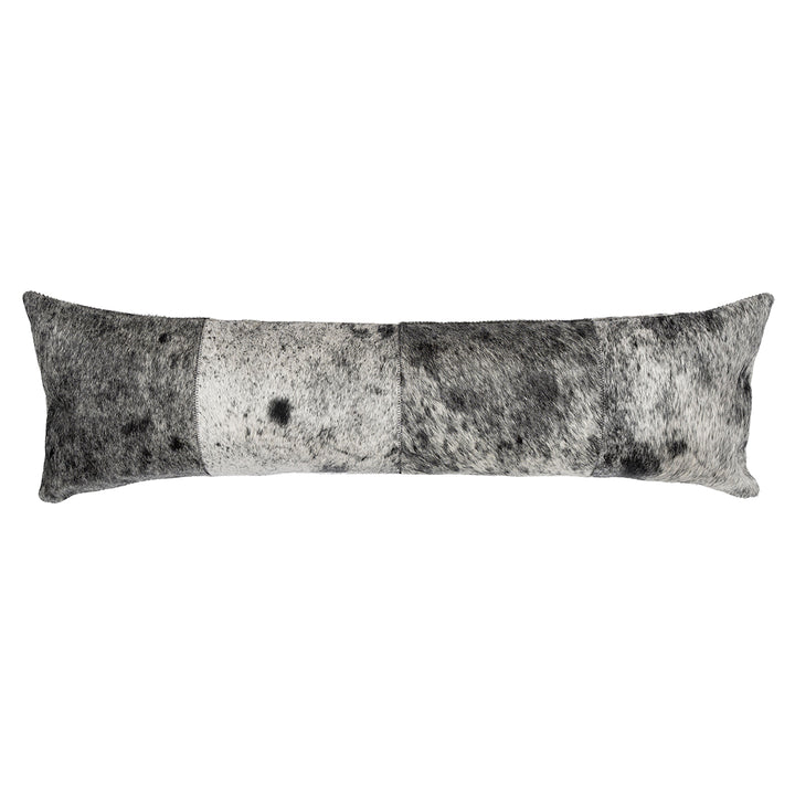 Long lumbar pillow in a patchwork design featuring black, white, and gray hair on hide with a salt-and-pepper speckled pattern.