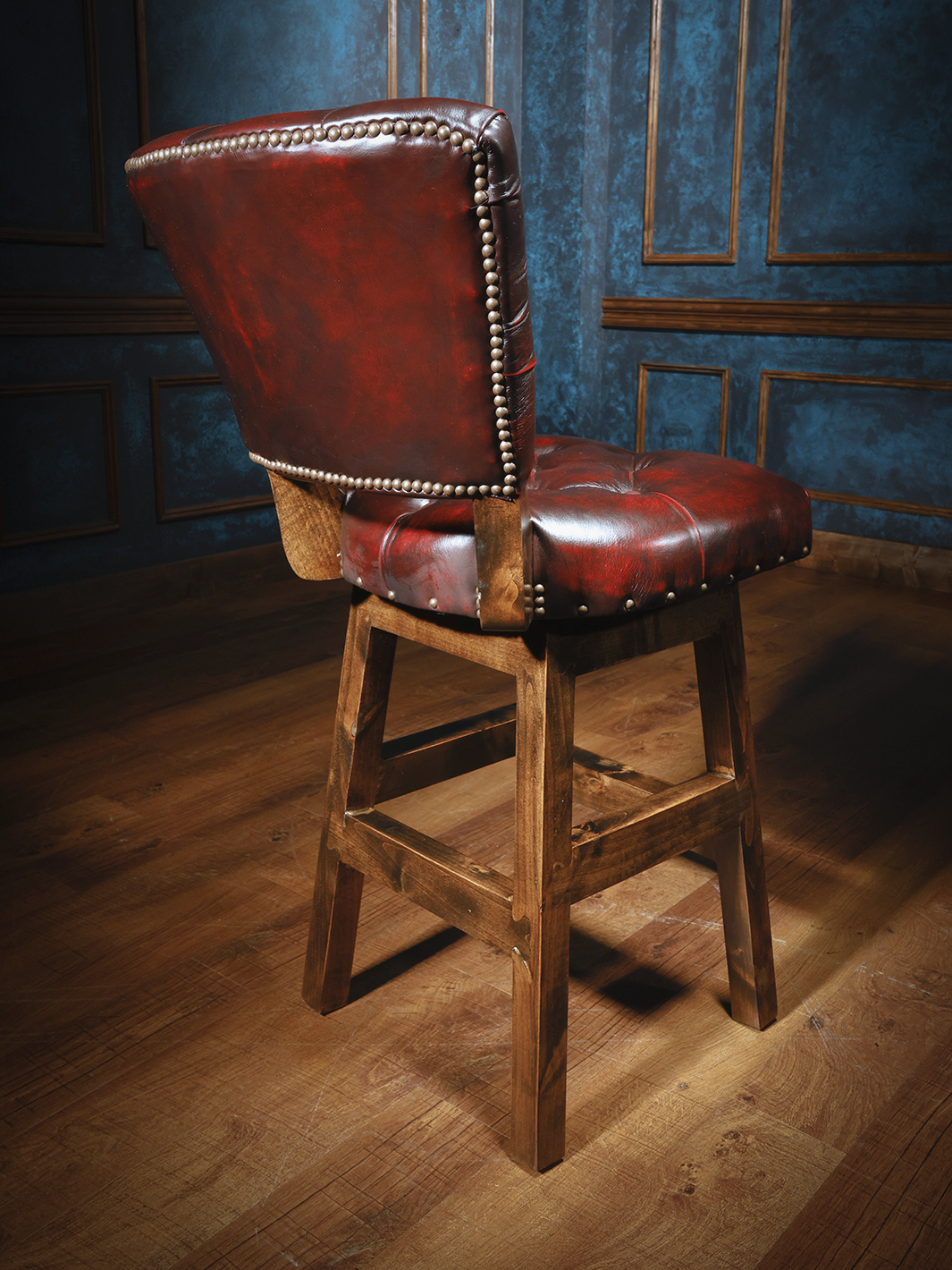 red armless western leather barstool