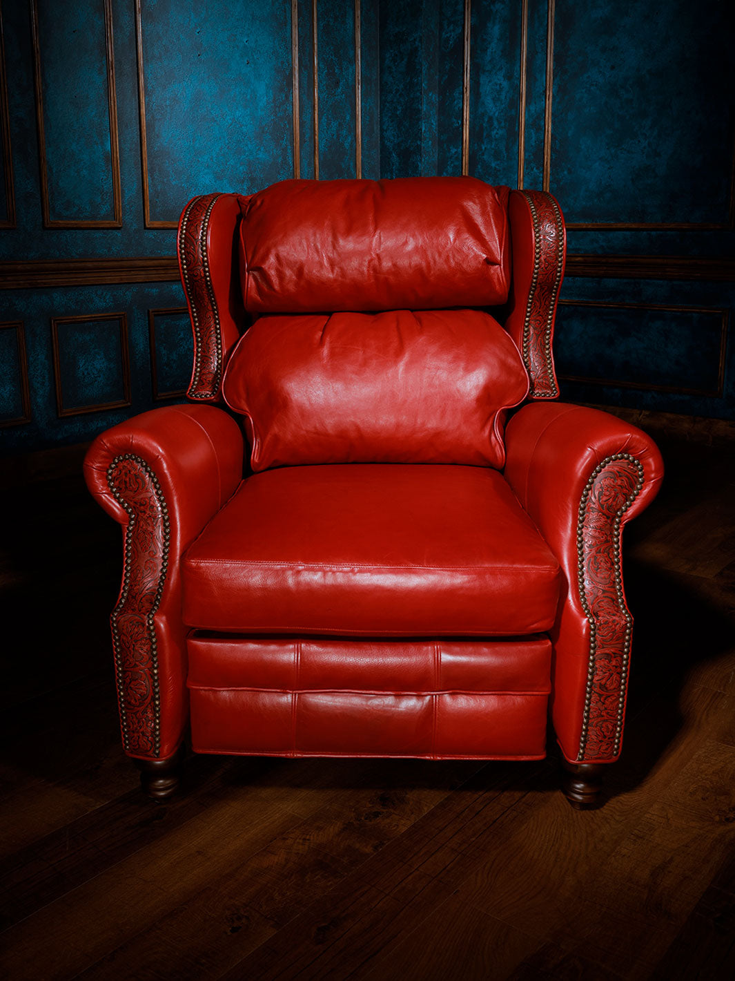 Red Rider Western Leather Recliner in distressed full aniline red leather with Cowboy Tooled trim and brass nailheads in a western inspired space.