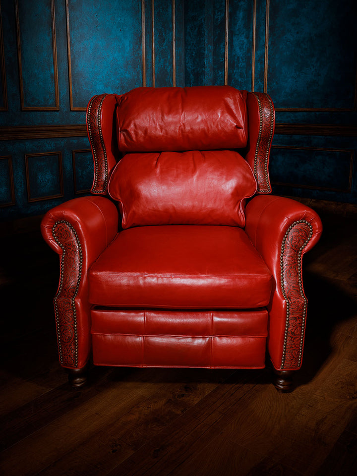 Red Rider Western Leather Recliner in distressed full aniline red leather with Cowboy Tooled trim and brass nailheads in a western inspired space.