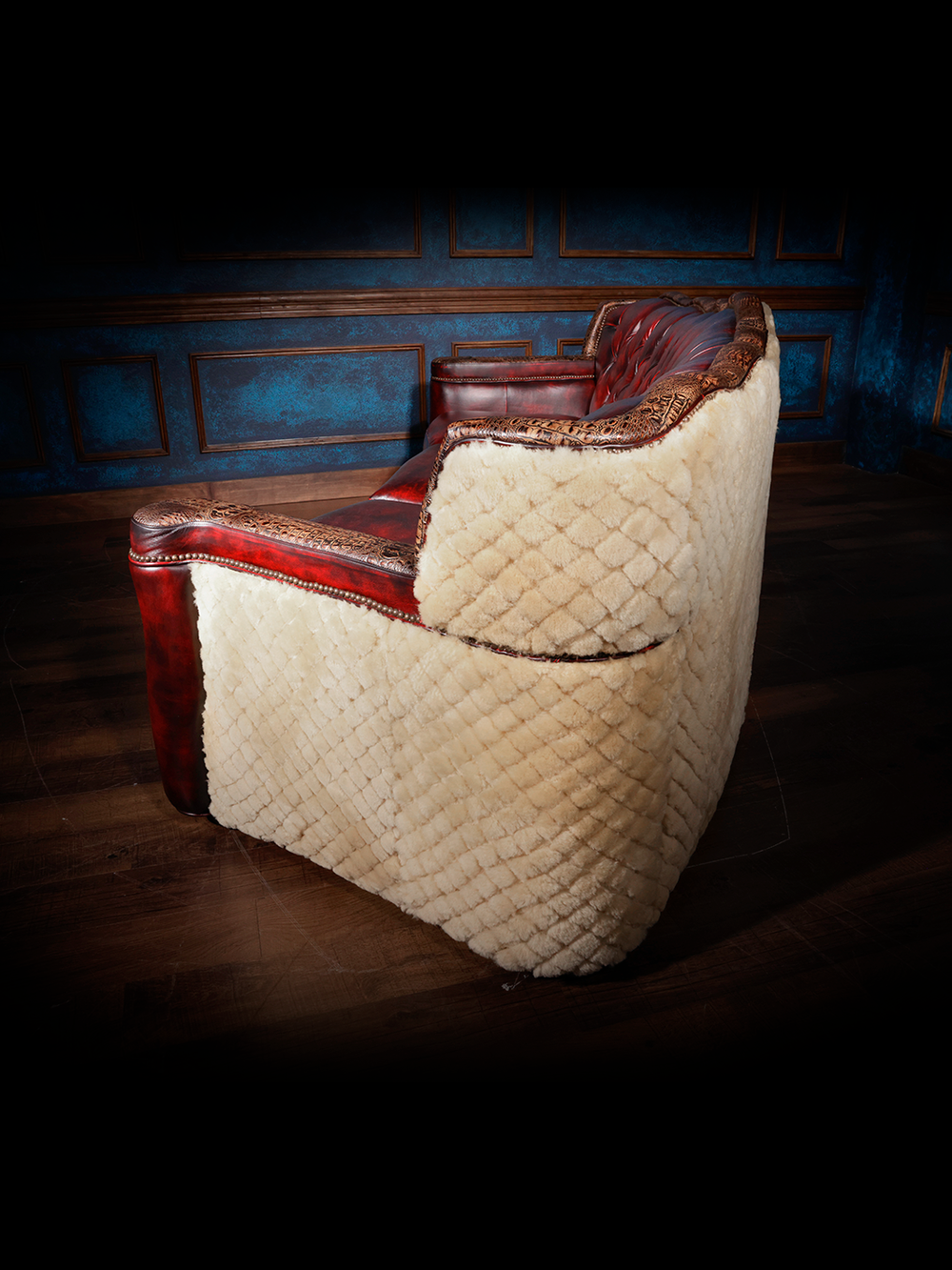 side view of red leather sofa with shearling