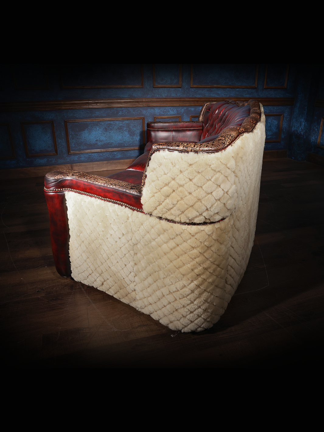 side view of red leather sofa with shearling