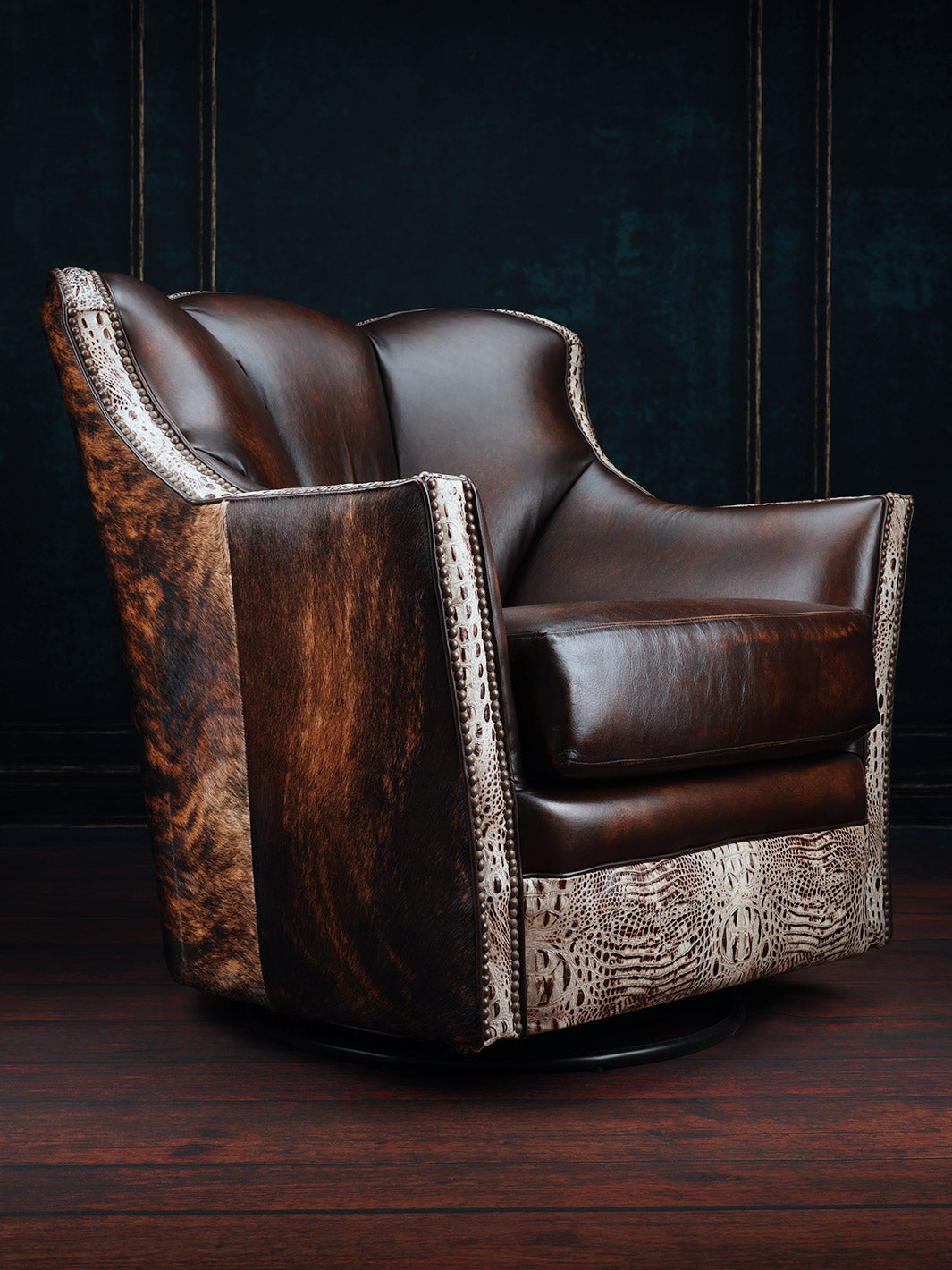 Tahoe Leather & Cowhide Swivel Chair in burnished brown full grain leather and cowhide accents in a western living space.