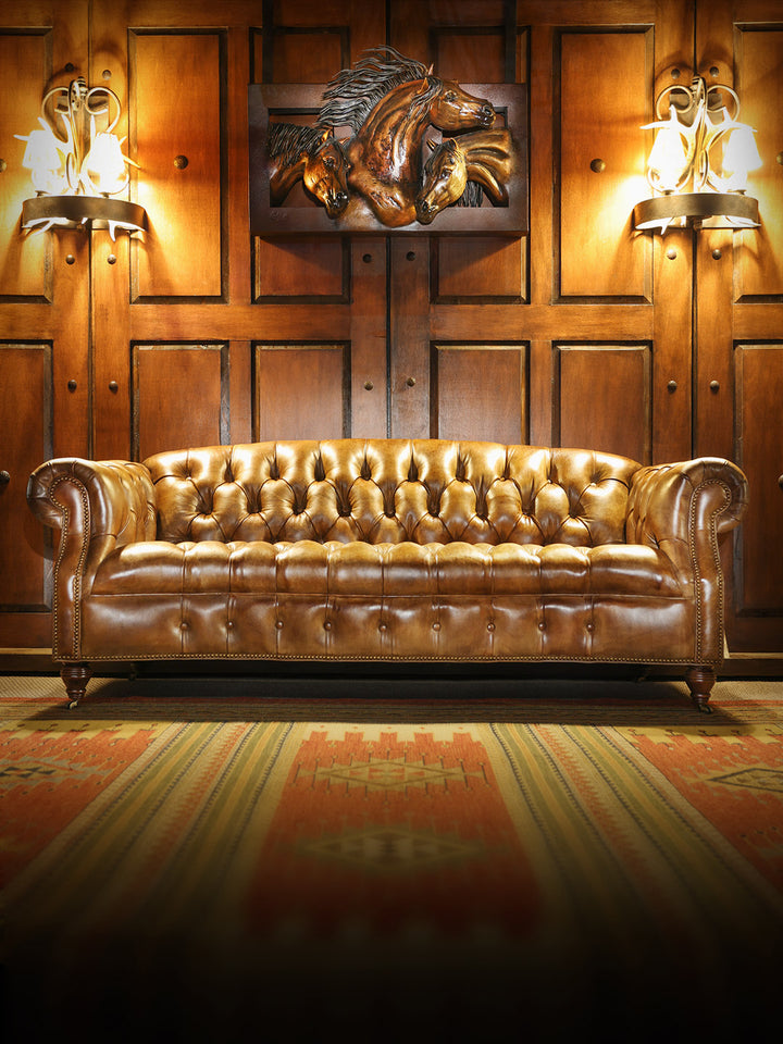 Weston Cane Chesterfield Leather Sofa in burnished brown leather with tufted leather detailing in a western living space.